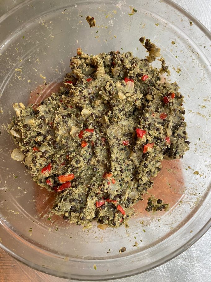 a mixing bowl with a mixture of the ingredients needed to make lentil meatballs