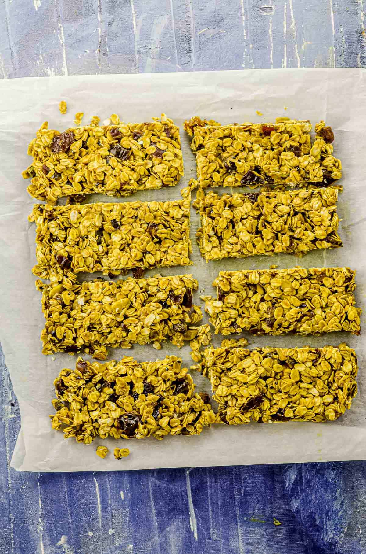 overhead image of 8 granola bars on top of parchment paper