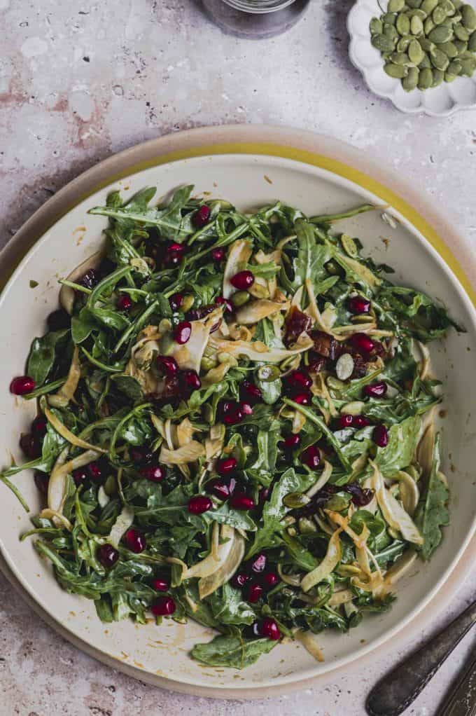 Close up of an arugula fennel salad