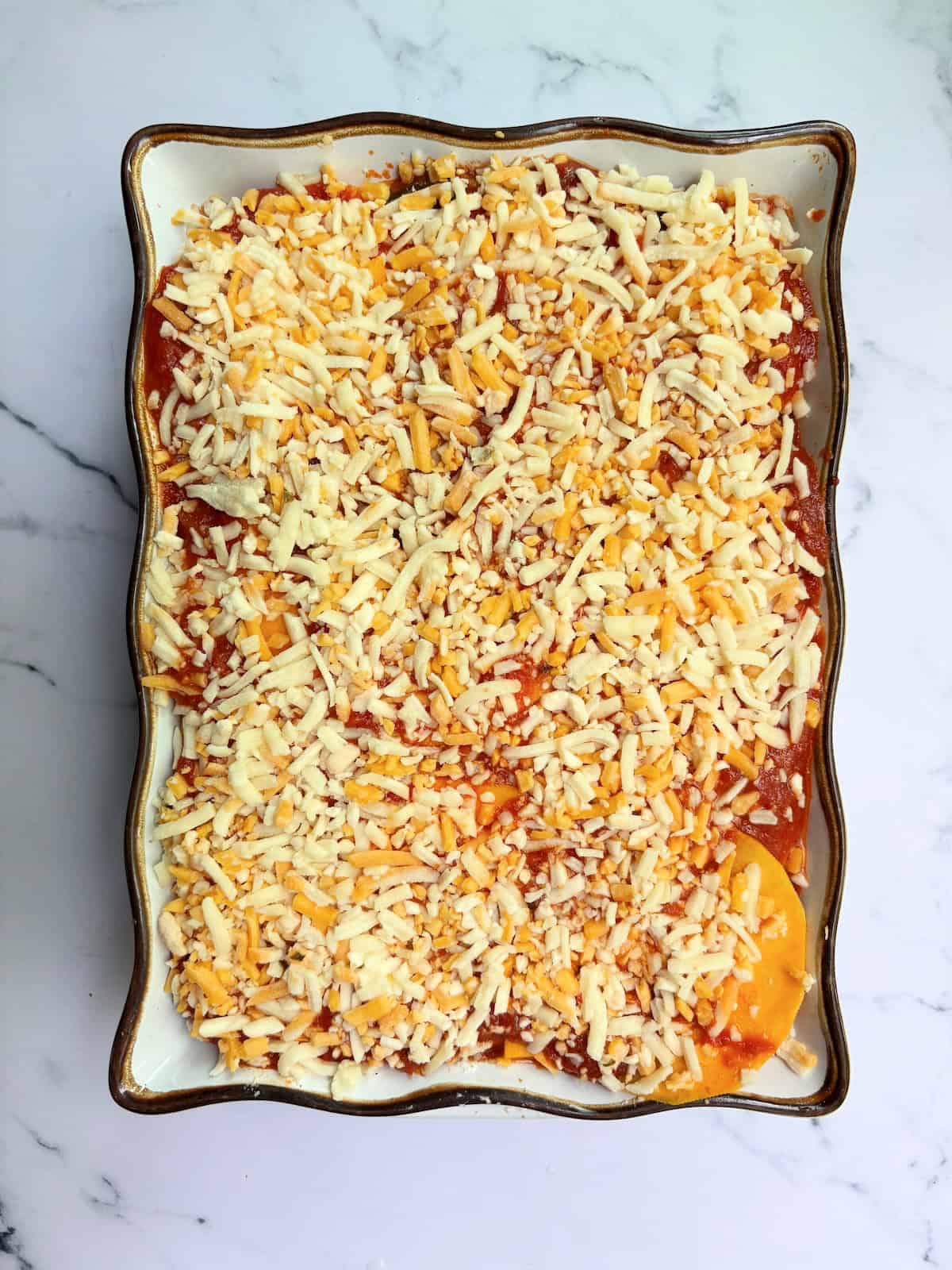 Shredded cheese, the last ;ayer of our vegetarian lasagna.  